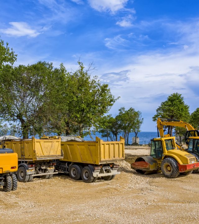day view of stopped industry vehicles at the construction site